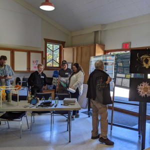 Community members explore the work of the Hakai Institute at the Quadra Island Community Center.